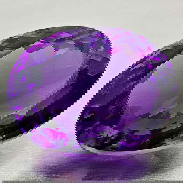 Natural Purple Amethyst 19.57 Ct. Oval Shape 18.7 x 15.2 Mm Gemstone from Brazil: Product ID: 800325503 Product Name: Natural Amethyst Weight: 19.57 CT. Size: 18.7 x 15.2 x 10.9 MM. Shape: Oval Color: Purple Clarity:VSI Luster: Good Gems Origin: Brazil Treatment: Unheated Crystal S