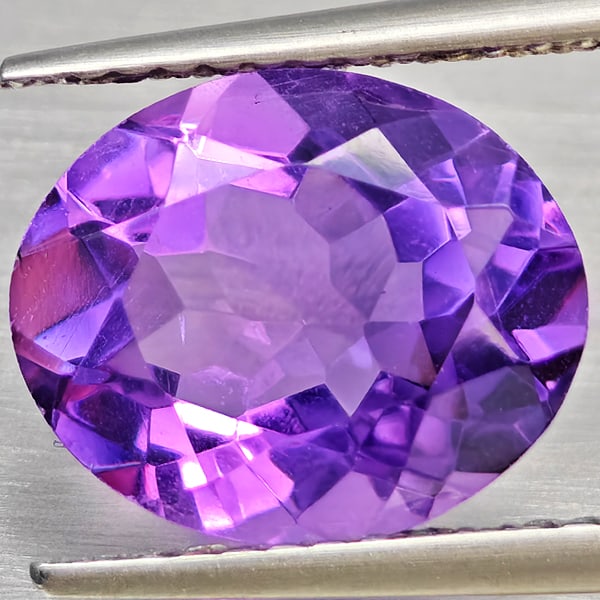 Natural Purple Amethyst 3.14 Ct. Oval Shape 11 x 9 Mm Gemstone from Brazil: Product ID: 800325522 Product Name: Natural Amethyst Weight: 3.14 CT. Size: 11 x 9 x 5.8 MM. Shape: Oval Color: Purple Clarity:VSI Luster: Good Gems Origin: Brazil Treatment: Unheated Crystal Structur