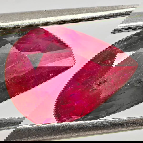 Natural Natural Purplish Red Ruby 1.59 Ct. Pear Shape 8.9 x 6.8 Mm Gemstone From Madagascar: Product ID: 805935573 Product Name: Natural Ruby Weight: 1.59 CT. Size: 8.9 x 6.8 x 3.8 MM. Shape: Pear Shape Color: Purplish Pink Clarity:VSI - SI1 Luster: Good Gems Origin: Madagascar Treatment: Hea