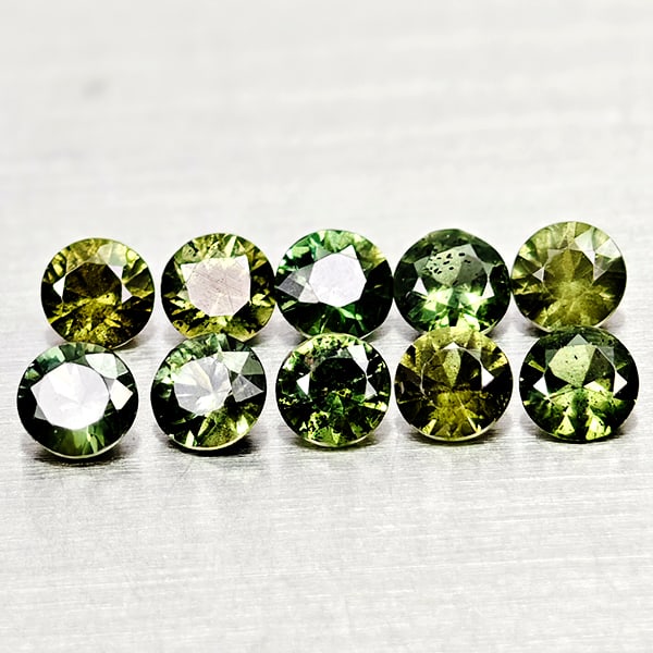 Natural Green Sapphire 1.09 Ct. 10 Pcs Round Diamond Cut Gemstones From Thailand: Product ID: 806162499 Product Name: Natural Green Sapphire Weight: 1.09 CT. Size: 3 x 3 x 1.8 to 2.8 x 2.8 x 1.8 MM. Shape: Round Diamond Cut Color: Green Clarity:VSI Luster: Good Gems Origin: Thailan