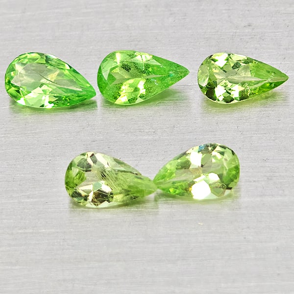 Natural Green Tsavorite Garnet 0.88 Ct. 5 Pcs Pear Shape 4.8 x 3 Mm Gemstones From Tanzania: Product ID: 803005103 Product Name: Natural Tsavorite Weight: 0.88 CT. Size: 4.8 x 2.9 x 1.7 MM. Shape: Pear Shape Color: Green Clarity:SI Luster: Good Gems Origin: Tanzania Treatment: Unheated Crysta