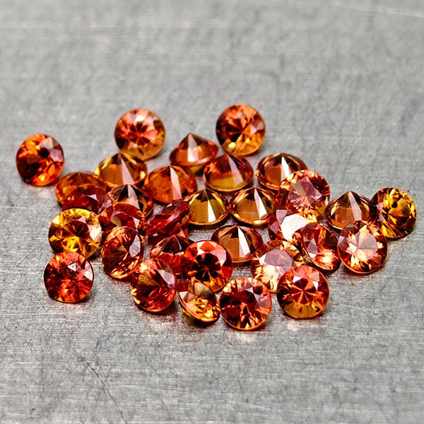 Natural Orange Red Songea Sapphire 1.58 Ct. 32 Pcs Round Diamond Cut 2.1 Mm Gemstones From Tanzania: Product ID: 806162100 Product Name: Natural Orange Sapphire Weight: 1.58 CT. Size: 2.1 2.1 x 1.2 MM. Shape: Round Diamond Cut Color: Orange Red Clarity:VSI Luster: Very Good Gems Origin: Tanzania Trea