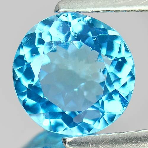 Natural Swiss Blue Topaz 1.79 Ct. Round Shape 7.9 Mm Gemstone From Brazil: Product ID: 807155271 Product Name: Natural Blue Topaz Weight: 1.79 CT. Size: 7.9 x 7.7 x 4.3 MM. Shape: Round Color: Swiss Blue Clarity:VSI Luster: Good Gems Origin: Brazil Treatment: Treated Crystal