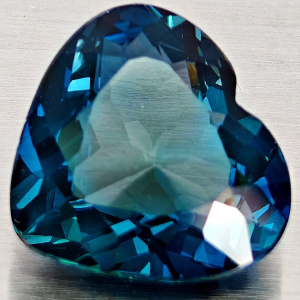 Natural London Blue Topaz 5.34 Ct. Heart Shape 11.8 x 10.9 Mm Gemstone From Brazil: Product ID: 807168362 Product Name: Natural Blue Topaz Weight: 5.34 CT. Size: 11.8 x 10.9 x 5.9 MM. Shape: Heart Shape Color: London Blue Clarity:VVS - VSI Luster: Good Gems Origin: Brazil Treatment: