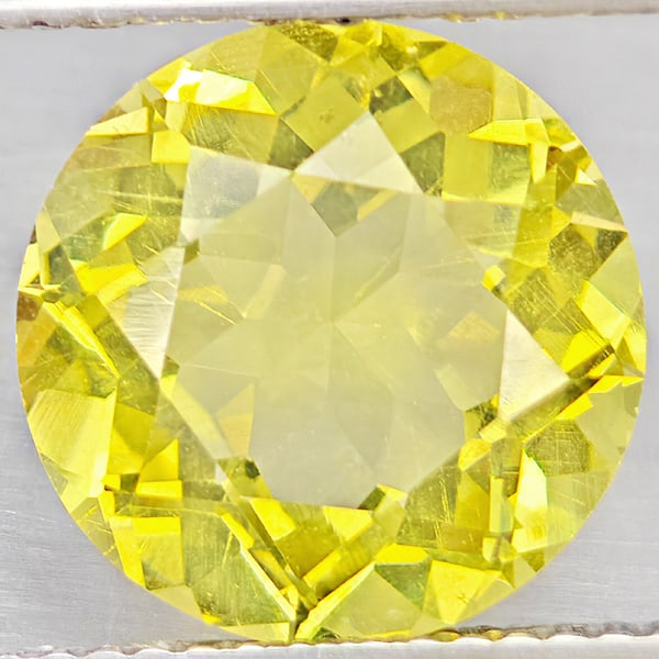 Natural Yellow Lemon Quartz 4.45 Ct. Round Shape 11.1 Mm Gemstone From Brazil: Product ID: 805530123 Product Name: Natural Quartz Weight: 4.45 CT. Size: 11.1 x 11.1 x 6.9 MM. Shape: Round Color: Yellow Lemon Clarity:VSI Luster: Good Gems Origin: Brazil Treatment: Unheated Crysta