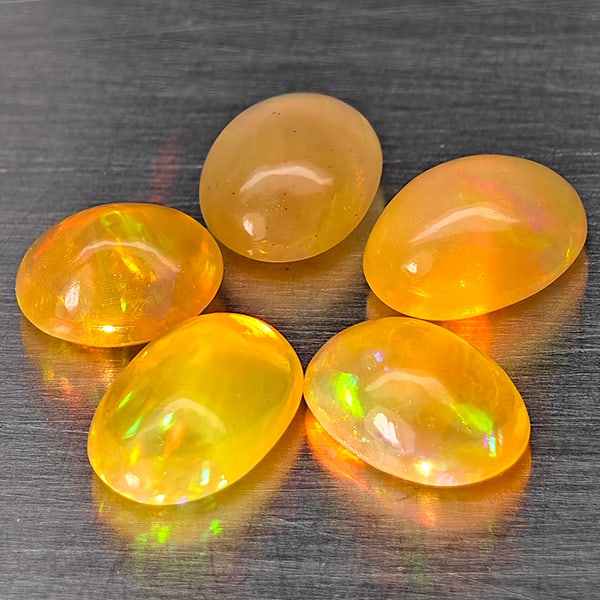 Natural Multi Color Opal 2.49 Ct. 5 Pcs Oval Cabochon Shape 7.3 x 3 Mm Gemstones From Ethiopia: Product ID: 818728429 Product Name: Natural Opal Weight: 2.49 CT. Size: 7.3 x 3 x 3 MM. Shape: Oval Cabochon Color: Multi-Color Clarity:Semi - Transparent Luster: Good Gems Origin: Ethiopia Treatment:
