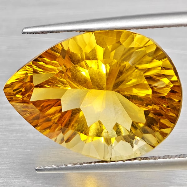 Natural Yellow Citrine 13.56 Ct. Clean Pear Concave Cut 19 x 14.1 Mm Gemstone From Brazil: Product ID: 801815399 Product Name: Natural Citrine Weight: 13.56 CT. Size: 19 x 14.1 x 10.4 MM. Shape: Pear Concave Cut Color: Yellow Clarity:VSI Luster: Good Gems Origin: Brazil Treatment: Unheated
