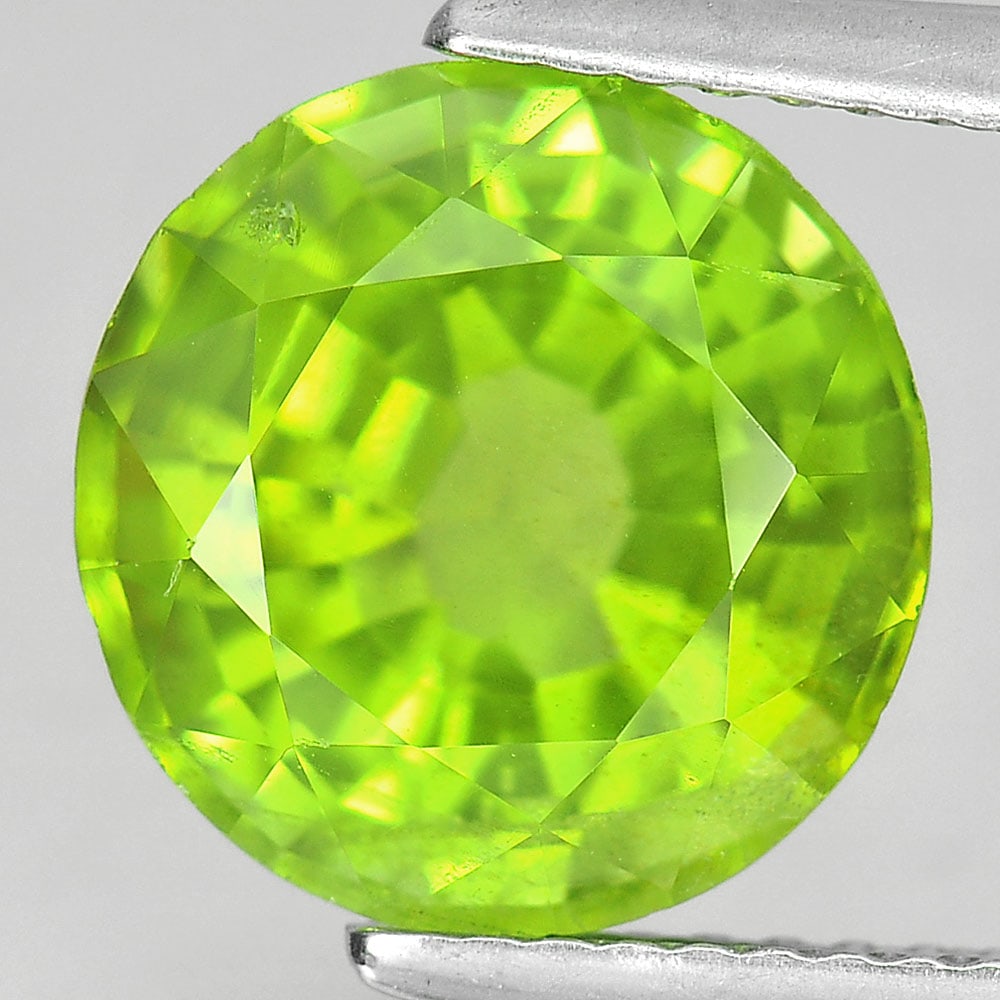 Natural Green Peridot 4.66 Ct. Oval Shape 10.4 x 10.2 Mm. Unheated Gemstone From Thailand: Product ID: 805305149 Product Name: Natural Peridot Weight: 4.66 CT. Size: 10.4 x 10.2 x 6.5 MM. Shape: Oval Color: Green Clarity:VSI Luster: Very Good Gems Origin: Thailand Treatment: Unheated Crysta