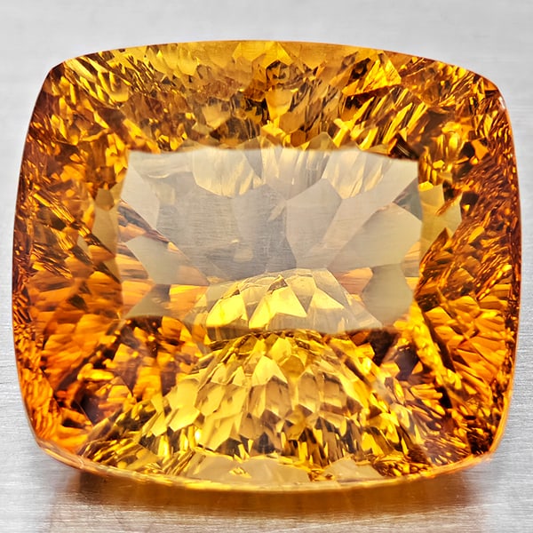 Natural Imperial Topaz 21.25 Ct. Cushion Concave Cut 16.5 x 14.9 Mm Gemstone From Brazil: Product ID: 807168628 Product Name: Natural Topaz Weight: 21.25 CT. Size: 16.5 x 14.9 x 10.3 MM. Shape: Cushion Concave Cut Color: Imperial Clarity:VSI Luster: Good Gems Origin: Brazil Treatment: Trea