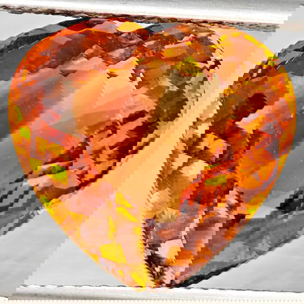 Natural Imperial Topaz 11.29 Ct. Heart Shape 14 x 13.4 Mm Gemstone From Brazil: Product ID: 807168573 Product Name: Natural Topaz Weight: 11.29 CT. Size: 14 x 13.4 x 8.2 MM. Shape: Heart Shape Color: Imperial Clarity:VSI Luster: Good Gems Origin: Brazil Treatment: Treated Crystal