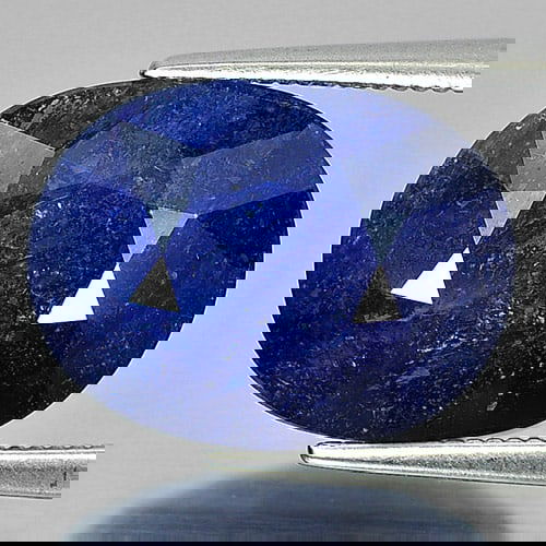Natural Deep Blue Sapphire 8.01 Ct. Oval Shape 14.6 x 11 Mm Gemstone From Madagascar: Product ID: 806010853 Product Name: Natural Blue Sapphire Weight: 8.01 CT. Size: 14.6 x 11 x 5.2 MM. Shape: Oval Color: Deep Blue Clarity:SI1 Luster: Good Gems Origin: Madagascar Treatment: Heated (Le