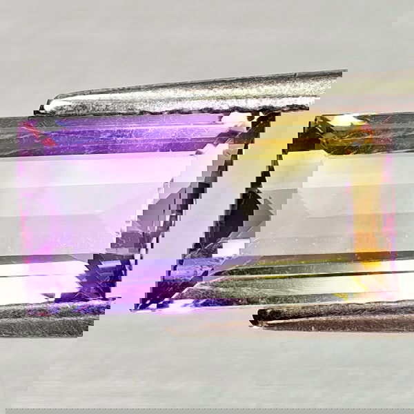 Natural Bi Color Ametrine 2.17 Ct. Octagon Shape 11.1 x 5.8 Mm Gemstone From Bolivia: Product ID: 800408231 Product Name: Natural Ametrine Weight: 2.17 CT. Size: 11.1 x 5.8 x 4.1 MM. Shape: Octagon Color: Bi Color Clarity:VSI Luster: Good Gems Origin: Bolivia Treatment: Unheated Crysta