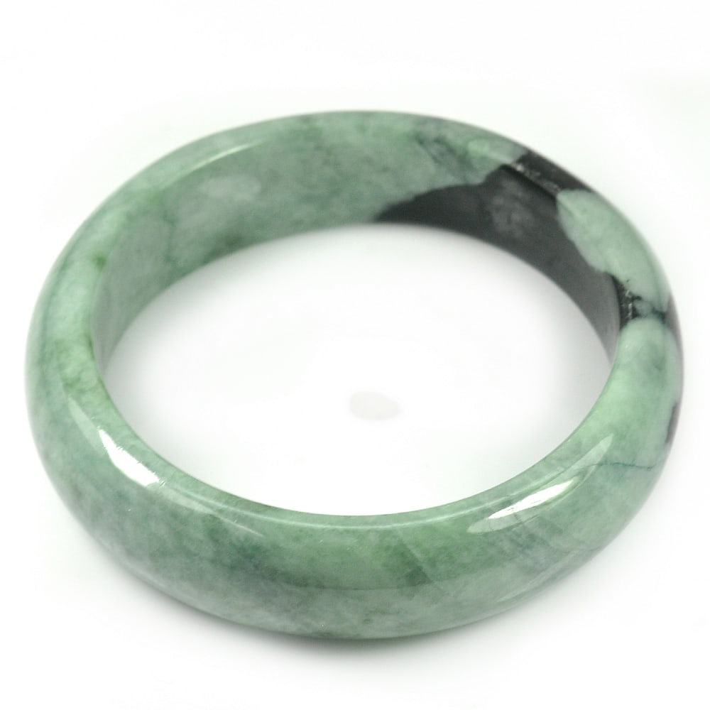 Natural Green Jade Bangle 410.72 Ct. Diameter 59 Mm. Unheated Gemstone: Product ID: 819814958 Product Name: Natural Jade Weight: 410.72 CT. Size: 74 x 59 x 18 MM. Shape: Round Color: Green Clarity:Opaque Luster: Good Gems Origin: Thailand Treatment: Unheated Crystal Struc