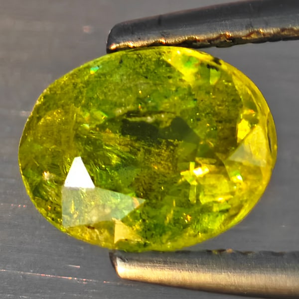 Natural Multi-Color With Rainbow Spark Sphene 0.94 Ct. Oval Shape 6.9 x 5.5 Mm Gemstone From: Product ID: 806509136 Product Name: Natural Sphene Weight: 0.94 CT. Size: 6.9 x 5.5 x 3.4 MM. Shape: Oval Shape Color: Multi-Color With Rainbow Spark Clarity:SI1 Luster: Good Gems Origin: Madagascar T
