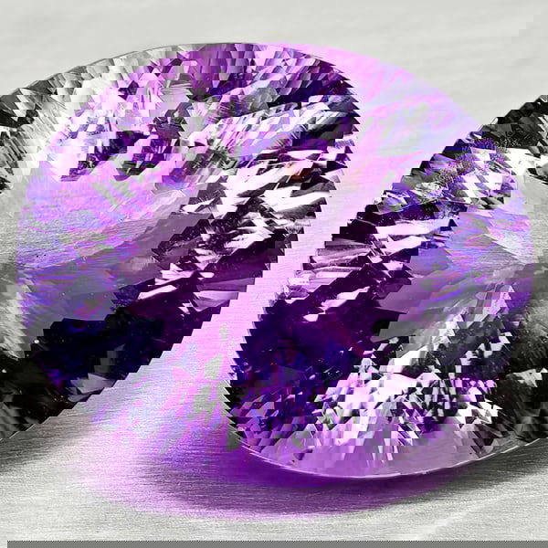 Natural Purple Amethyst 19.07 Ct. Oval Concave Cut 19.5 x 16.7 Mm Gemstone From Brazil: Product ID: 800325386 Product Name: Natural Amethyst Weight: 19.07 CT. Size: 19.5 x 16.7 x 10.5 MM. Shape: Oval Concave Color: Purple Clarity:VVS Luster: Good Gems Origin: Brazil Treatment: Unheated C