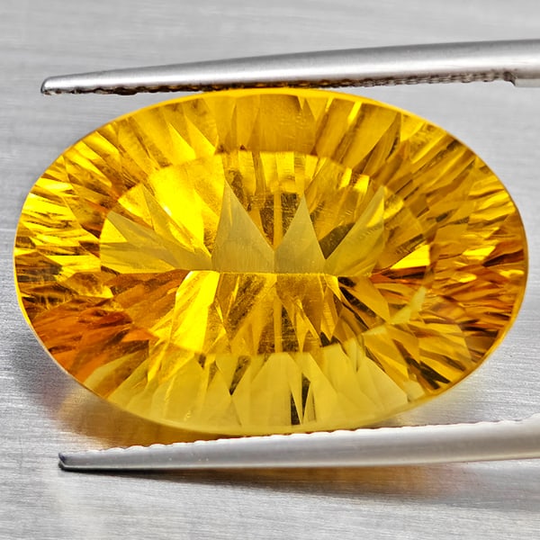 Natural Yellow Citrine 16.37 Ct. Clean Oval Concave Cut 20 x 13.7 Mm Gemstone From Brazil: Product ID: 801815403 Product Name: Natural Citrine Weight: 16.37 CT. Size: 20 x 13.7 x 10.5 MM. Shape: Oval Concave Color: Yellow Clarity:VSI Luster: Good Gems Origin: Brazil Treatment: Unheated Crys