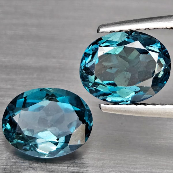 Natural London Blue Topaz 4.88 Ct. 2 Pcs Oval Shape 9 x 7.2 Mm Gemstones From Brazil: Product ID: 807168936 Product Name: Natural Blue Topaz Weight: 4.88 CT. Size: 9 x 7.2 x 5 MM. Shape: Oval Color: London Blue Clarity:SI1 Luster: Good Gems Origin: Brazil Treatment: Treated Crystal Str