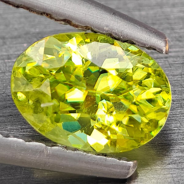 Natural Multi-Color With Rainbow Spark Sphene 0.86 Ct. Oval Shape 6.4 x 4.5 Mm Gemstone From: Product ID: 806509309 Product Name: Natural Sphene Weight: 0.86 CT. Size: 6.4 x 4.5 x 3.7 MM. Shape: Oval Color: Multi-Color Clarity:SI1 Luster: Good Gems Origin: Madagascar Treatment: Unheated Crysta