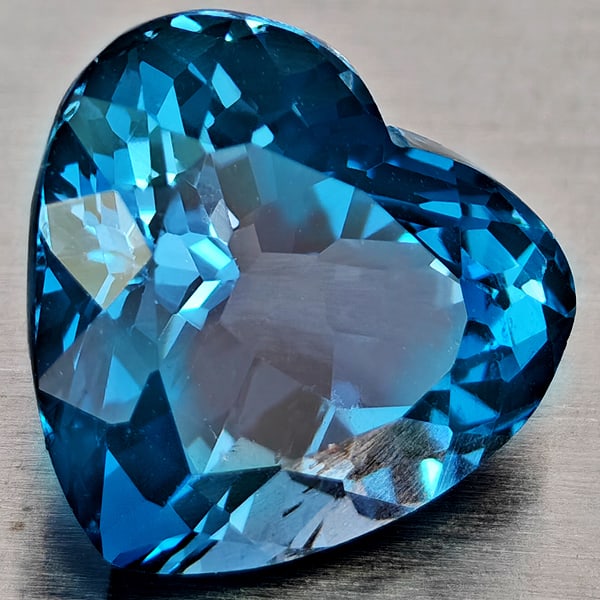 Natural London Blue Topaz 4.16 Ct. Heart Shape 9.8 x 9.1 Mm Gemstone From Brazil: Product ID: 807168360 Product Name: Natural Blue Topaz Weight: 4.16 CT. Size: 9.8 x 9.1 x 6.7 MM. Shape: Heart Shape Color: London Blue Clarity:VVS - VSI Luster: Good Gems Origin: Brazil Treatment: Tr