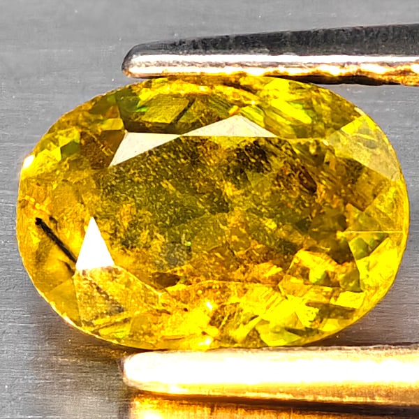 Natural Multi Color Sphene Rainbow Spark 1.52 Ct. Oval Shape 7.9 x 5.7 Mm Gemstone From Madagascar: Product ID: 806509079 Product Name: Natural Sphene Weight: 1.52 CT. Size: 7.9 x 5.7 x 3.9 MM. Shape: Oval Color: Multi-Color Clarity:SI1 Luster: Good Gems Origin: Madagascar Treatment: Unheated Crysta