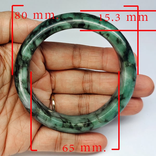 Natural Genuine Mulit Color Jade 445.56 Ct. Bangle Round Shape 80 x 65 Mm Gemstone from Thailand: Product ID: 819816085 Product Name: Natural Gemstones Weight: 445.56 CT. Size: 80 x 65 x 15.3 MM. Shape: Round Shape Color: Multi-Color Green Clarity:Opaque Luster: Good Gems Origin: Thailand Treatmen