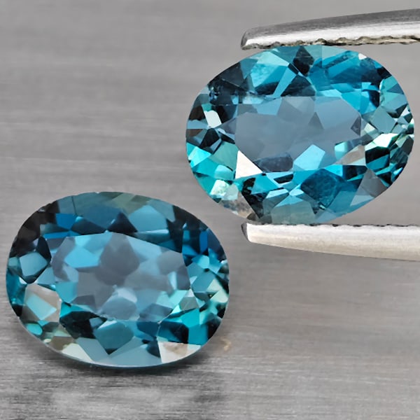 Natural London Blue Topaz 4.37 Ct. 2 Pcs Oval Shape 9 x 7.1 Mm Gemstones From Brazil: Product ID: 807168887 Product Name: Natural Blue Topaz Weight: 4.37 CT. Size: 9 x 7.1 x 5 MM. Shape: Oval Color: London Blue Clarity:SI1 Luster: Good Gems Origin: Brazil Treatment: Treated Crystal Str
