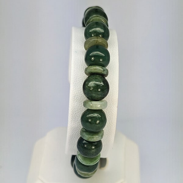 Natural Green Jade Beads Stretch Bracelet 143.52 Ct. Gemstone From Thailand: Product ID: 818102714 Product Name: Natural Jade Weight: 143.52 CT. Size: 2.5 x 9.4 MM. Shape: Mix Cabochon Color: Multi-Color Green Clarity:Opaque Luster: Good Gems Origin: Thailand Treatment: Unheat