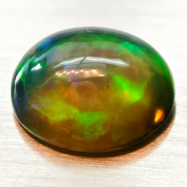 Natural Multi-Color Opal 1.89 Ct. Cushion Cabochon Shape 10 x 8 Mm. Unheated Gemstone: Product ID: 818728020 Product Name: Natural Opal Weight: 1.89 CT. Size: 10 x 8 x 14.7 MM. Shape: Oval Cabochon Color: Multi-Color Clarity:Semi - Transparent Luster: GoodSemi - Transparent Gems Origin: