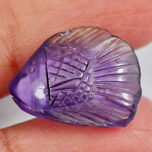 Natural Violet Amethyst 8.41 Ct. Fish Carving Shape 18.2 x 13.5 Mm Gemstone From Brazil: Product ID: 810302983 Product Name: Natural Amethyst Weight: 8.41 CT. Size: 18.2 x 13.5 x 6.3 MM. Shape: Fish Carving Color: Violet Clarity:Semi - Transparent Luster: Good Gems Origin: Brazil Treatmen