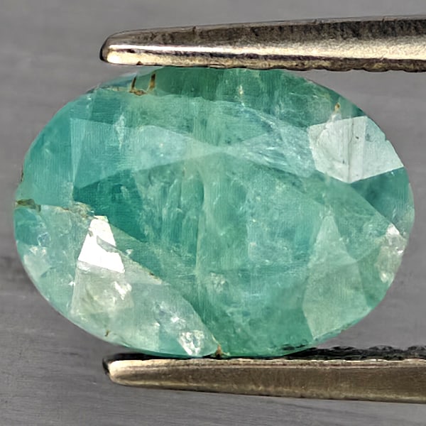 Natural Green Blueish Grandidierite 2.26 Ct. Oval Shape 9 x 6.8 Mm Gemstone from Madagascar: Product ID: 803100086 Product Name: Natural Tsavorite Weight: 2.26 CT. Size: 9 x 6.8 x 5.3 MM. Shape: Oval Shape Color: Green Blueish Clarity:SI1 Luster: Good Gems Origin: Madagascar Treatment: Unheat