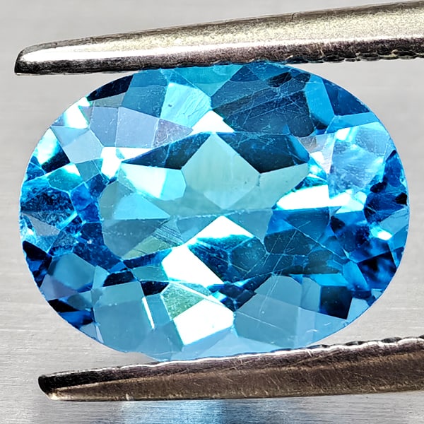 Natural Swiss Blue Topaz 2.34 Ct. Oval Shape 9.1 x 7.1 Mm Gemstone From Brazil: Product ID: 807168157 Product Name: Natural Blue Topaz Weight: 2.34 CT. Size: 9.1 x 7.1 x 4.9 MM. Shape: Oval Shape Color: Swiss Blue Clarity:VVS - VSI Luster: Good Gems Origin: Brazil Treatment: Trea