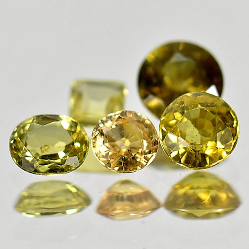 Natural Yellow Sapphire 1.55 Ct. Mix Shape 5 Pcs. Gemstone From Thailand: Product ID: 806152100 Product Name: Natural Yellow Sapphire Weight: 1.55 CT. Size: 4.6 x 4.6 x 2.7 MM. Shape: Mix Shape Color: Yellow Clarity:SI1 Luster: Good Gems Origin: Thailand Treatment: Heated C