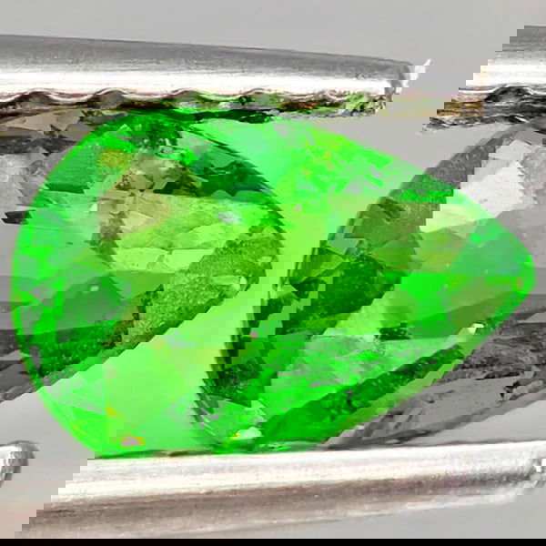 Natural Green Tsavorite Garnet 0.55 Ct. Pear Shape 5.9 x 4.3 Mm Gemstone From Tanzania: Product ID: 802937037 Product Name: Natural Tsavorite Weight: 0.55 CT. Size: 5.9 x 4.3 x 2.9 MM. Shape: Pear Shape Color: Green Clarity:SI1 Luster: Good Gems Origin: Tanzania Treatment: Unheated Cryst