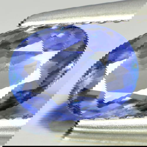 Certified Natural Bluish Violet Tanzanite 0.88 Ct. Oval Shape 7.43 x 5.47 Mm Gemstone from Tanzania: Product ID: 807001510 Product Name: Natural Tanzanite Weight: 0.88 CT. Size: 7.43 x 5.47 x 2.65 MM. Shape: Oval Color: Violet Clarity:VSI Luster: Good Gems Origin: Tanzania Treatment: Heated Crystal S