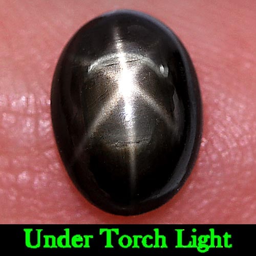 Natural Black Star Sapphire 6 Rays 1.55 Ct. Oval Cabochon Shape 8 x 5.8 Mm. Gemstone: Product ID: 806153869 Product Name: Natural Star Sapphire Weight: 1.55 CT. Size: 8 x 5.8 x 3 MM. Shape: Oval Cabochon Color: Black Clarity:Opaque Luster: Good 6 Rays Star Gems Origin: Thailand Treatme