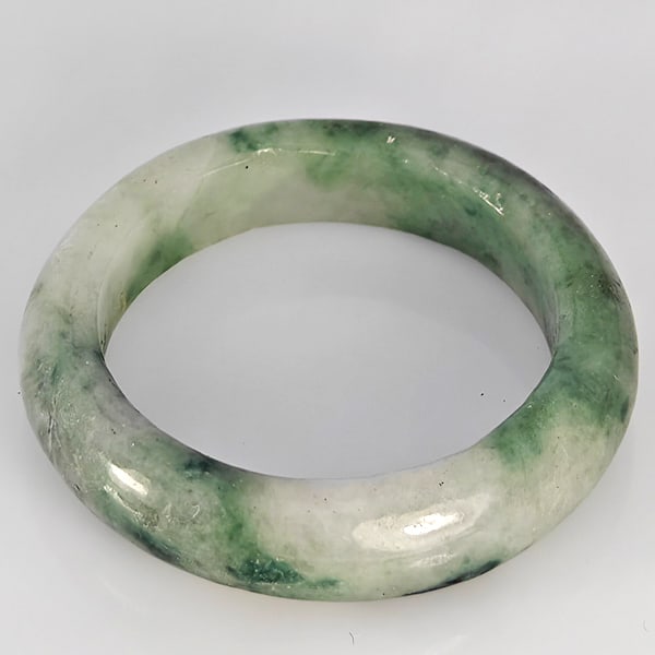 Natural Genuine Mutil-Color Green Jade 16.80 Ct. Round Cabochon Ring Size 9.5 Gemstone from Thailand: Product ID: 819816286 Product Name: Natural Jade Weight: 16.80 CT. Size: MM. Shape: Round Cabochon Color: Multi-Color Green Clarity:Opaque Luster: Good Gems Origin: Thailand Treatment: Unheated Crysta