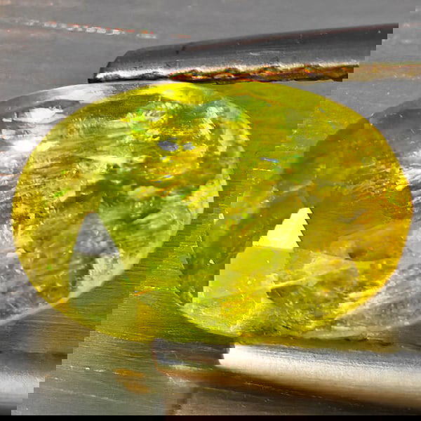 Natural Multi-Color With Rainbow Spark Sphene 1.91 Ct. Oval Shape 9.2 x 6 Mm Gemstone From: Product ID: 806509200 Product Name: Natural Sphene Weight: 1.91 CT. Size: 9.2 x 6 x 4.5 MM. Shape: Oval Shape Color: Multi-Color Clarity:SI1 Luster: Good Gems Origin: Madagascar Treatment: Unheated Cr