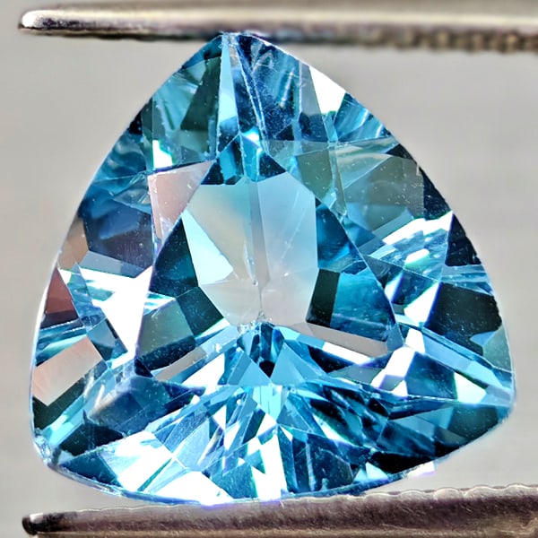 Natural Swiss Blue Topaz 6.34 Ct. Trilliant Shape 12 Mm Gemstone From Brazil: Product ID: 807167929 Product Name: Natural Blue Topaz Weight: 6.34 CT. Size: 12 x 12 x 7.1 MM. Shape: Trilliant Color: Swiss Blue Clarity:VSI Luster: Good Gems Origin: Brazil Treatment: Treated Cryst