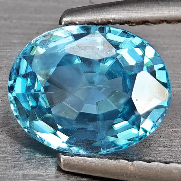 Natural Blue Zircon 2.12 Ct. Oval Shape 7.8 x 6.3 Mm Gemstone from Cambodia: Product ID: 807743057 Product Name: Natural Zircon Weight: 2.12 CT. Size: 7.8 x 6.3 x 4.2 MM. Shape: Oval Color: Blue Clarity:VSI Luster: Good Gems Origin: Cambodia Treatment: Heated Crystal Structure