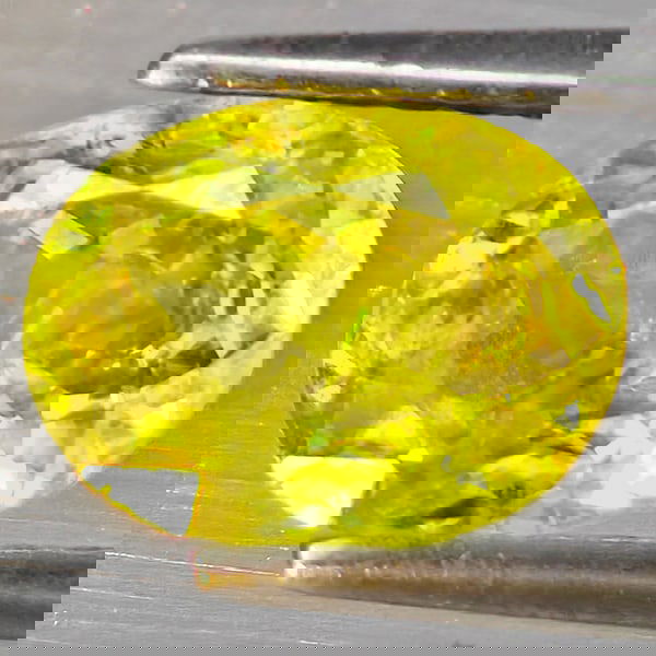 Natural Multi Color Sphene Rainbow Spark 1.48 Ct. Oval Shape 8 x 6.2 Mm Gemstone From Madagascar: Product ID: 806509086 Product Name: Natural Sphene Weight: 1.48 CT. Size: 8 x 6.2 x 4 MM. Shape: Oval Color: Multi-Color Clarity:SI1 Luster: Good Gems Origin: Madagascar Treatment: Unheated Crystal St