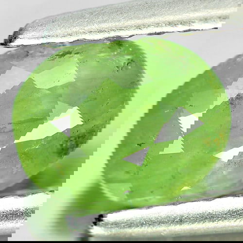 Natural Green Demantoid Garnet 1.12 Ct. Oval Shape 6.6 x 5.3 Mm Gemstone from Madagascar: Product ID: 802919256 Product Name: Natural Demantoid Weight: 1.12 CT. Size: 6.6 x 5.3 x 3.9 MM. Shape: Oval Color: Green Clarity:SI Luster: Good Gems Origin: Madagascar , Africa Treatment: Unheated C