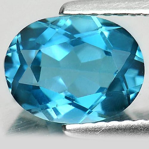 Natural London Blue Topaz 2.24 Ct. VVS Oval Shape 9 x 7 Mm. Gemstone From Brazil: Product ID: 807161691 Product Name: Natural Blue Topaz Weight: 2.24 CT. Size: 9 x 7 x 4.5 MM. Shape: Oval Color: London Blue Clarity:VVS Luster: Good Gems Origin: Brazil Treatment: Treated Crystal Str
