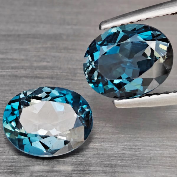 Natural London Blue Topaz 4.22 Ct. 2 Pcs Oval Shape 9 x 7.1 Mm Gemstones From Brazil: Product ID: 807168930 Product Name: Natural Blue Topaz Weight: 4.22 CT. Size: 9 x 7.1 x 4.5 MM. Shape: Oval Color: London Blue Clarity:SI1 Luster: Good Gems Origin: Brazil Treatment: Treated Crystal S