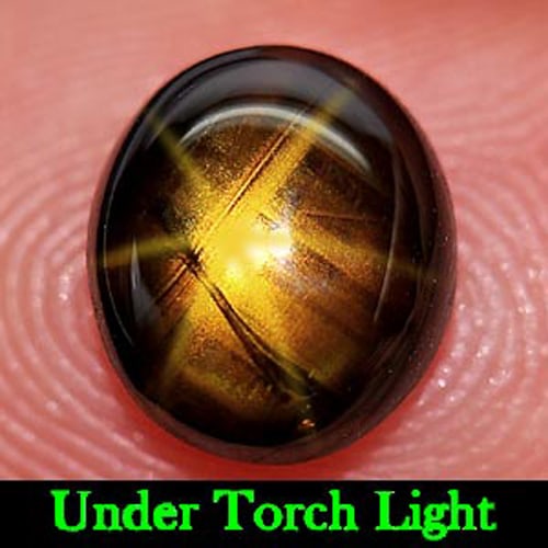 Natural Golden Star Sapphire 6 Ray 2.07 Ct. Oval Cabochon Shape 6.76 x 7.78 Mm. Gemstone: Product ID: 806149963 Product Name: Natural Star Sapphire Weight: 2.07 CT. Size: 6.76 x 7.78 x 3.31 MM. Shape: Oval Cabochon Color: Yellow Clarity:Opaque Luster: Good 6 Ray Star Gems Origin: Thailand