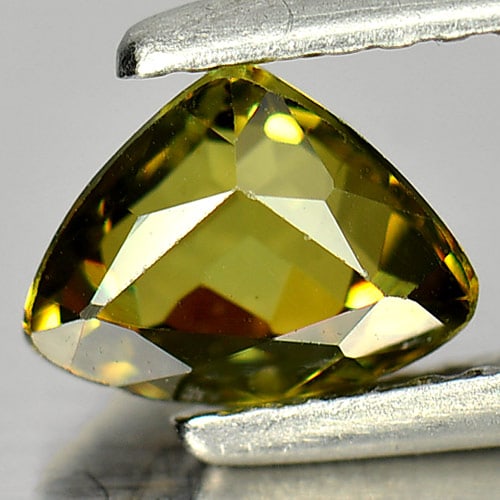 Natural Greenish Yellow Demantoid Garnet 1.08 Ct. Trilliant Shape 7 x 5.4 Mm. Gemstone From: Product ID: 802931367 Product Name: Natural Demantoid Weight: 1.08 CT. Size: 7 x 5.4 x 3.9 MM. Shape: Trilliant Color: Greenish Yellow Clarity:VSI Luster: Good Gems Origin: Madagascar Treatment: