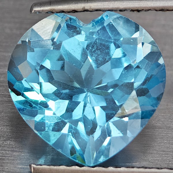 Natural Baby Blue Topaz 4.90 Ct. Heart Shape 11 Mm Gemstone From Brazil: Product ID: 807168726 Product Name: Natural Blue Topaz Weight: 4.90 CT. Size: 11 x 11 x 6 MM. Shape: Heart Shape Color: Baby Blue Clarity:VSI Luster: Good Gems Origin: Brazil Treatment: Treated