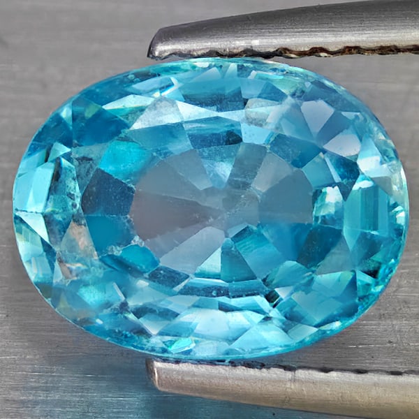 Natural Blue Zircon 3.37 Ct. Oval Shape 9.8 x 7.5 Mm Gemstone from Cambodia: Product ID: 807743073 Product Name: Natural Zircon Weight: 3.37 CT. Size: 9.8 x 7.5 x 4.5 MM. Shape: Oval Shape Color: Blue Clarity:VSI Luster: Good Gems Origin: Cambodia Treatment: Heated Crystal