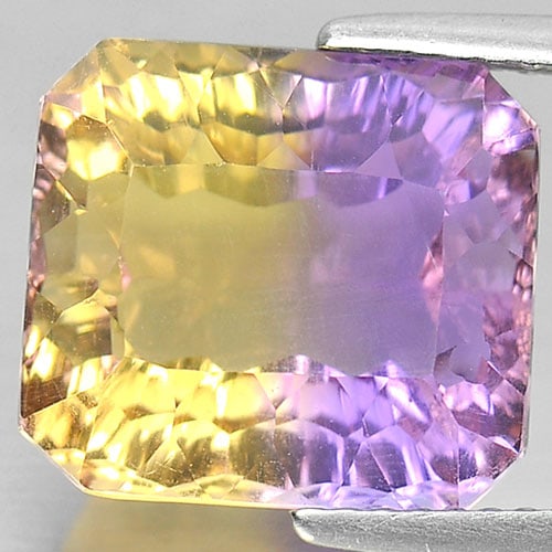 Natural Bi Color Ametrine 8.13 Ct. Clean Octagon Millennium Cut 12.2 x 11 Mm. Gemstone From Bolivia: Product ID: 800408006 Product Name: Natural Ametrine Weight: 8.13 CT. Size: 12.2 x 11 x 8.2 MM. Shape: Octagon Millennium Cut Color: Bi Color Clarity:IF Luster: Very Good Gems Origin: Bolivia Treatmen