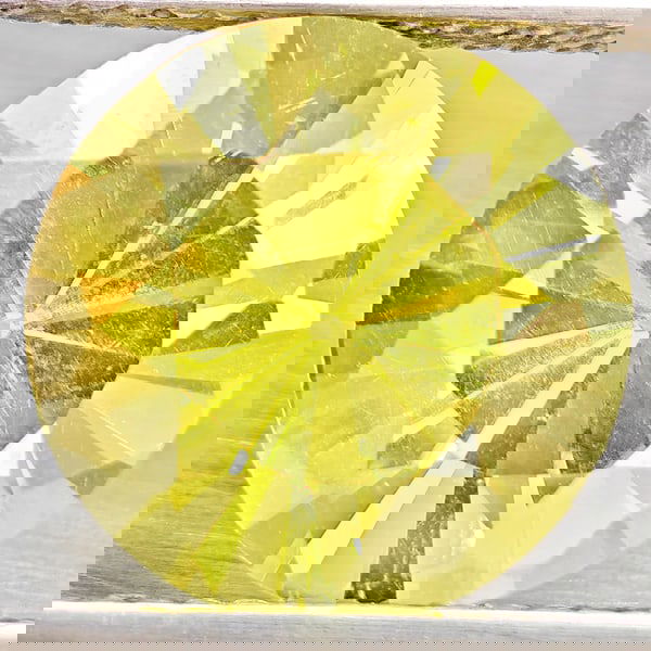 Natural Yellow Lemon Quartz 4.53 Ct. Round Diamond Cut 11 Mm Gemstone From Brazil: Product ID: 805530115 Product Name: Natural Quartz Weight: 4.53 CT. Size: 11 x 11 x 7.7 MM. Shape: Round Diamond Cut Color: Yellow Lemon Clarity:VSI Luster: Good Gems Origin: Brazil Treatment: Unheate