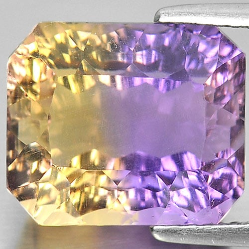 Natural Bi Color Ametrine 8.37 Ct. VVS Octagon Millennium Cut Shape 12.4 x 10.6 Mm. Unheated: Product ID: 800408029 Product Name: Natural Ametrine Weight: 8.37 CT. Size: 12.4 x 10.6 x 8.4 MM. Shape: Octagon Millennium Cut Color: Bi Color Clarity:VVS Luster: Good Gems Origin: Bolivia Treatment: